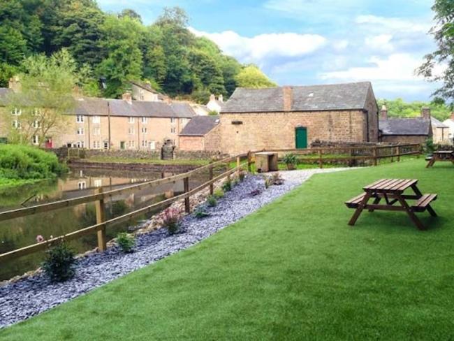 Large, stone-built, 3-storey, waterside Peak District holiday cottage.