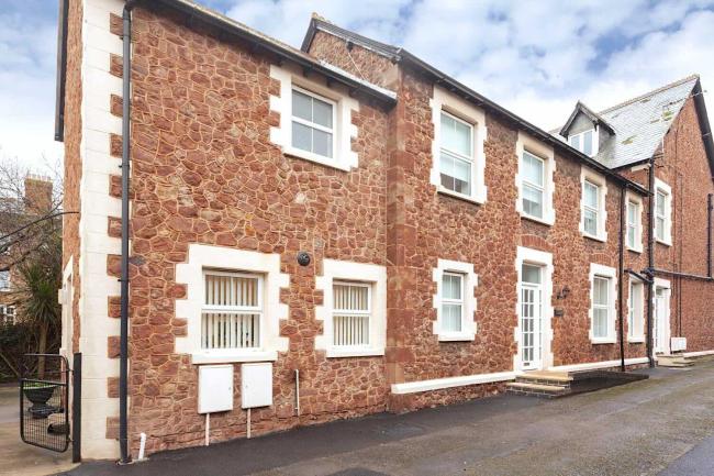 Stone-built terraced Minehead holiday cottage on a quiet village street.