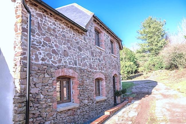 2-storey, stone-built holiday lodge in a rural location.