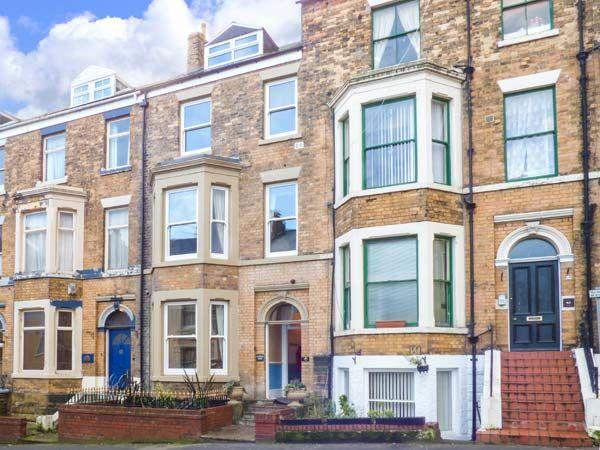Terraced, 4-storey, Victorian Seaside Townhouse with bay windows.