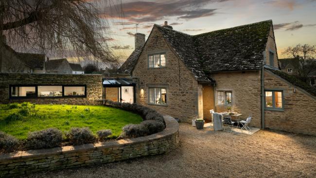 Exterior of Culls Cottage holiday home at night