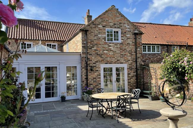 The outside seating area in the walled garden at Pear Tree House 
