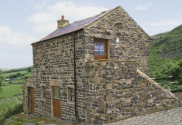 A remote 2-storey barn conversion in a moorland location.