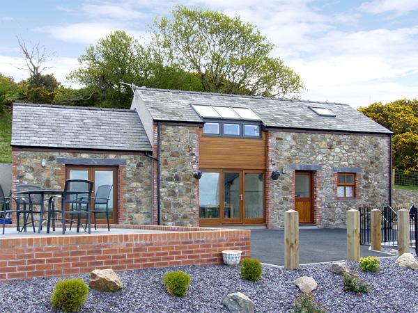 Exterior of a 2-storey, stone barn conversion near Bangor