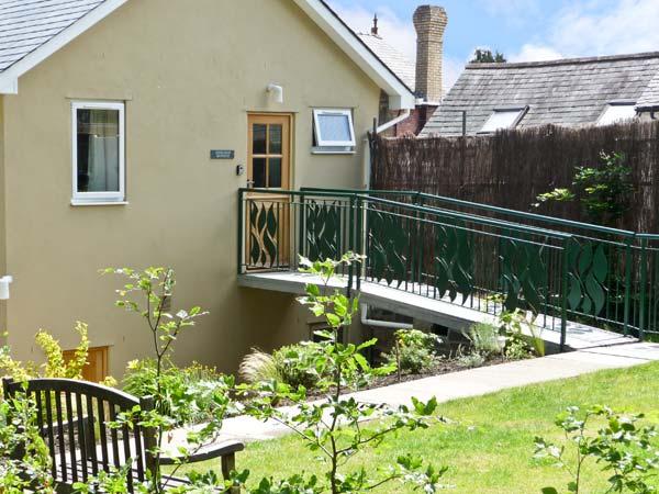 Gable end of a Shropshire Holiday Cottage wth a 1st floor entrance approached via a bridge.