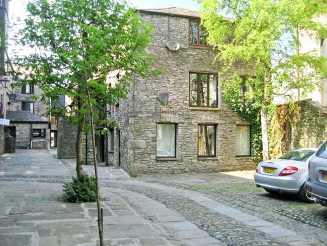 A 3-storey, stone-built holiday apartment in KEndal in a tree-lined courtyard.