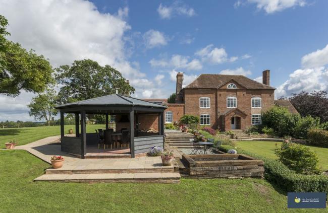 Aa largendouble-fronted, 33-storey detached house overlooks  a spacious garden with an octagonal summerhouse